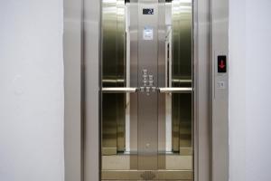 an elevator in a building with a glass door at Villa Antonio in Ulcinj