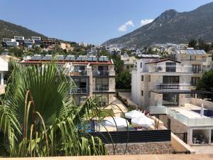 a view of a city with buildings and a mountain at Stonehouse Aparts Dublex 3+1 mit Meerblick und Jakuzzi Kalkan No:5 in Kalkan