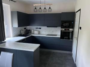 A kitchen or kitchenette at Talabér Vendégház