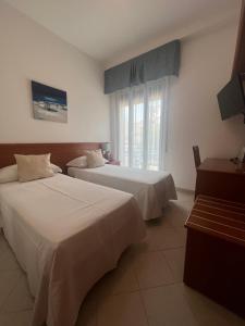 Кровать или кровати в номере Hotel Noris