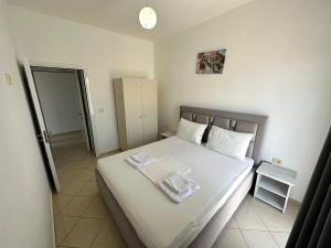 Postel nebo postele na pokoji v ubytování Joni Apartments