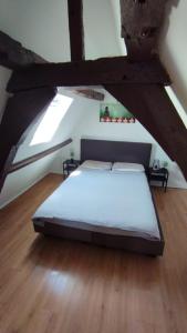 a bedroom with a bed in an attic at The 16th Century Duplex in The City Center in Antwerp