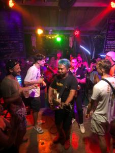 a group of people standing in a nightclub at Da Housetel Kuta in Kuta +135 photos