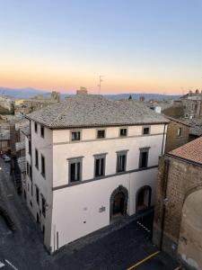 a view of a building in a city at Hotel Palazzo Piccolomini in Orvieto