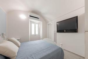 H11 [Piccola Perla] a un passo dal Mare客房内的一张或多张床位