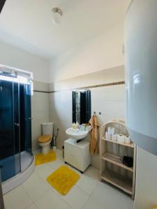 a bathroom with a sink and a shower and a toilet at Apartmány Superrelax in Liptovský Mikuláš