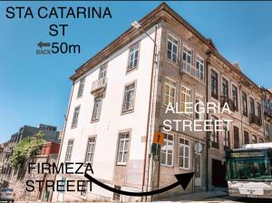 a bus is parked in front of a building at Firmeza 358 studios - street level in Porto
