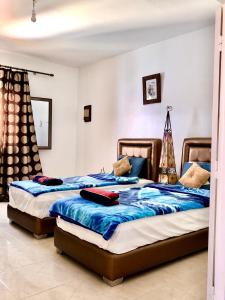 Tempat tidur dalam kamar di Casa Karam