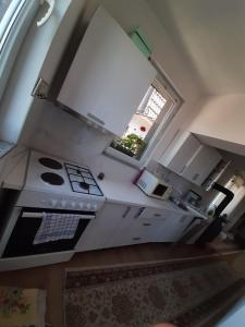 an overhead view of a kitchen with a stove and a window at View in Sarajevo