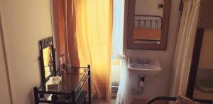 a bathroom with a sink and a window at L'Eau Berge - Relais Motards - GTMC & Tour des Vaches B&B in Allanche +34 photos