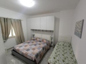 Postel nebo postele na pokoji v ubytování Mamalina Residence