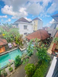 an aerial view of a building with a swimming pool at Nami House in Ubud