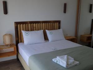 Postel nebo postele na pokoji v ubytování RM Green Hotel