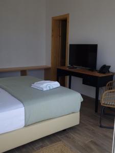 Postel nebo postele na pokoji v ubytování RM Green Hotel