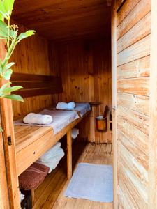 a wooden cabin with two bunk beds in it at The Secret Garden Hideaway in Mossel Bay