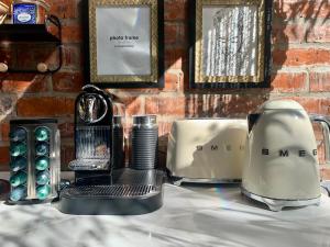 a table with a appliance on top of a counter at The Secret Garden Hideaway in Mossel Bay