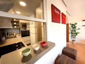 Η κουζίνα ή μικρή κουζίνα στο KS Golf Playa - Kaleria Suites