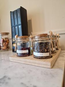 two jars of food sitting on a cutting board at De Hofstee in Maastricht