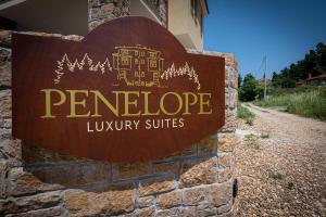 a sign for a ponderosa luxury suite at Penelope Luxury Suites in Fourka