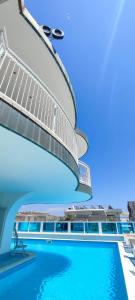 a view of a swimming pool on a cruise ship at Hotel B&B Negresco in Milano Marittima