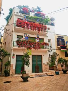 a building with flower boxes on the side of it at Casa Farella B&B in mini Apartments Altamura x Matera in Altamura