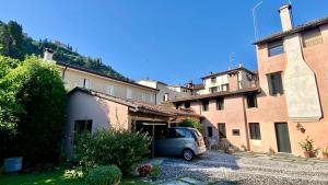 a van parked in a parking lot next to a building at Regina dei fiori in Marostica