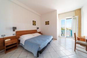 Postel nebo postele na pokoji v ubytování Hotel CasaDei + 37 fotografií