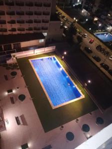 an overhead view of a swimming pool at night at Habitaciones playa de Gandía in Playa de Gandia
