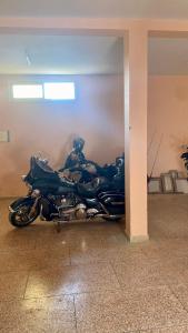 a blue motorcycle parked in a garage at Welcome to Big BL's house, Close to Tanger Med in Ksar es Sghir
