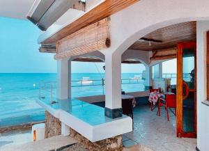 a house on the beach with a view of the ocean at Moana Beach House in Moalboal