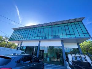 a car parked in front of a building at Melur Inn, Tok Jembal in Kampong Tanjong Gelam