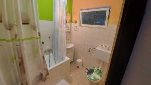 a bathroom with a shower and a toilet and a sink at House Lanterna Pag in Pag +12 photos