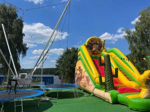 a inflatable water slide on a cruise ship at Family & Business Sauna Apartments No1 Leśny nad Zalewem Cedzyna Unikat - 3 Bedroom with Private Sauna, Bath with Hydromassage, Terrace, Garage, Catering Options in Kielce