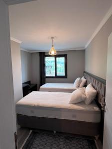 Postel nebo postele na pokoji v ubytování Next Suite