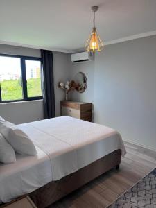 Postel nebo postele na pokoji v ubytování Next Suite
