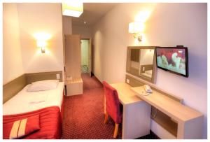 TV a/nebo společenská místnost v ubytování Arche Hotel Siedlce