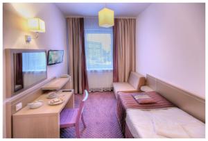 TV a/nebo společenská místnost v ubytování Arche Hotel Siedlce