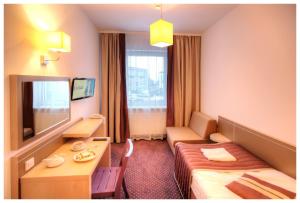 TV a/nebo společenská místnost v ubytování Arche Hotel Siedlce
