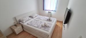 Postel nebo postele na pokoji v ubytování Apartments Vedran