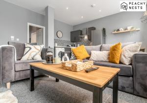 a living room with a couch and a coffee table at Contractor Pad with off-Road Parking Sleeps 5 in Norwich