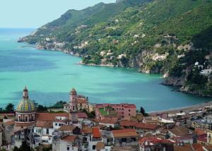 a view of a town next to a body of water at Casa Fortuna - Intero alloggio al centro di Cava in Cava deʼ Tirreni +9 photos