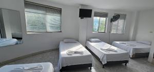 Uma cama ou camas num quarto em Hotel Bayadera Real