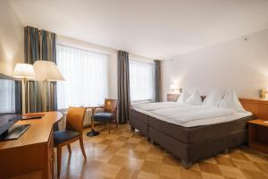 Postel nebo postele na pokoji v ubytování BLUME Baden Hotel & Restaurant