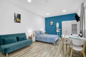 TV a/nebo společenská místnost v ubytování Umihouse apartamentos centro Alicante