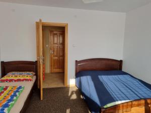 Postel nebo postele na pokoji v ubytování Pokoje I Apartamenty