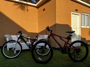 two bikes are parked next to a house at tree house eilat in Eilat