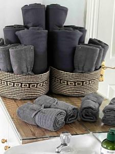 a group of baskets sitting on a counter with towels at Harbour View Cottage, Rochespoint, Cork Harbour in Midleton