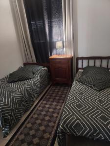 Postel nebo postele na pokoji v ubytování Appartement meublé avec deux chambres
