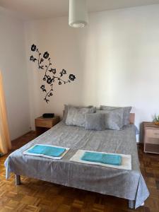 a bedroom with a bed with two mats on it at Apartments Andrović in Ulcinj