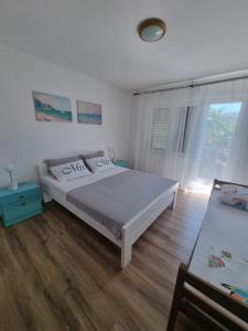 Postel nebo postele na pokoji v ubytování Apartman Frketić